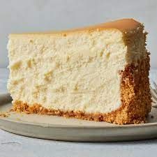 Plain cheesecake slice on a dessert plate