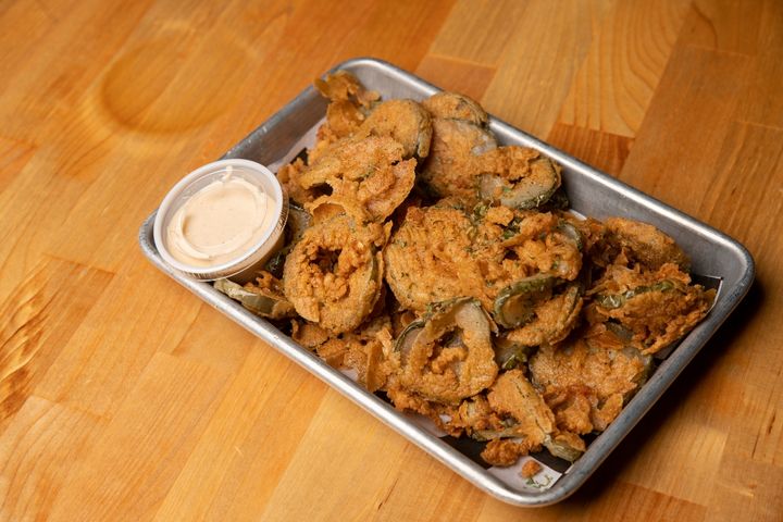 Baking pan of battered and fried dill pickle chips